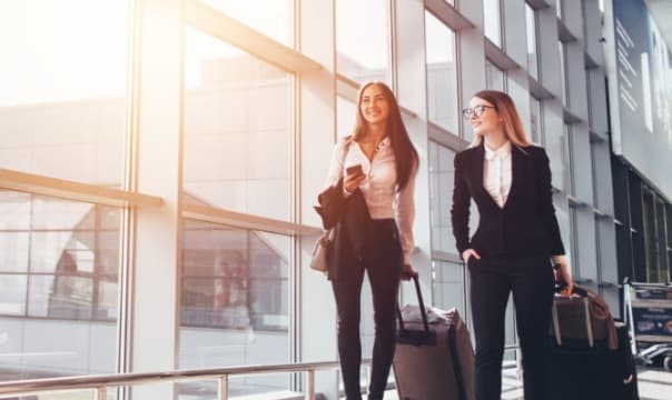 two women with suitcases