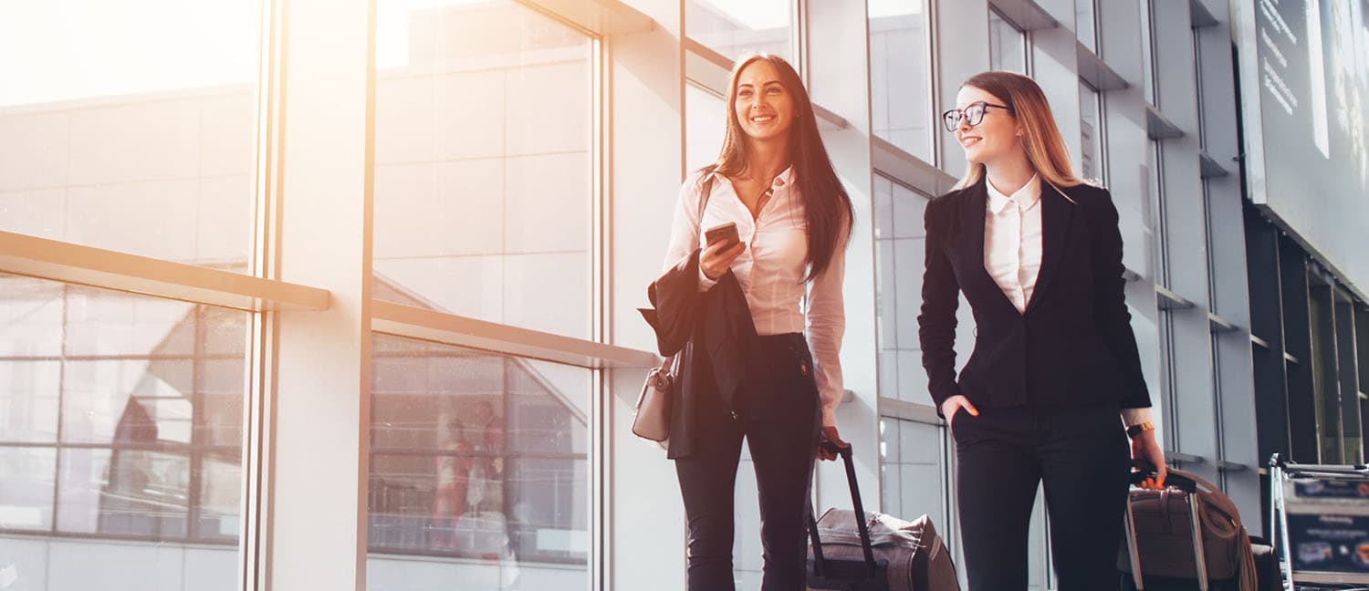 two women with suitcases