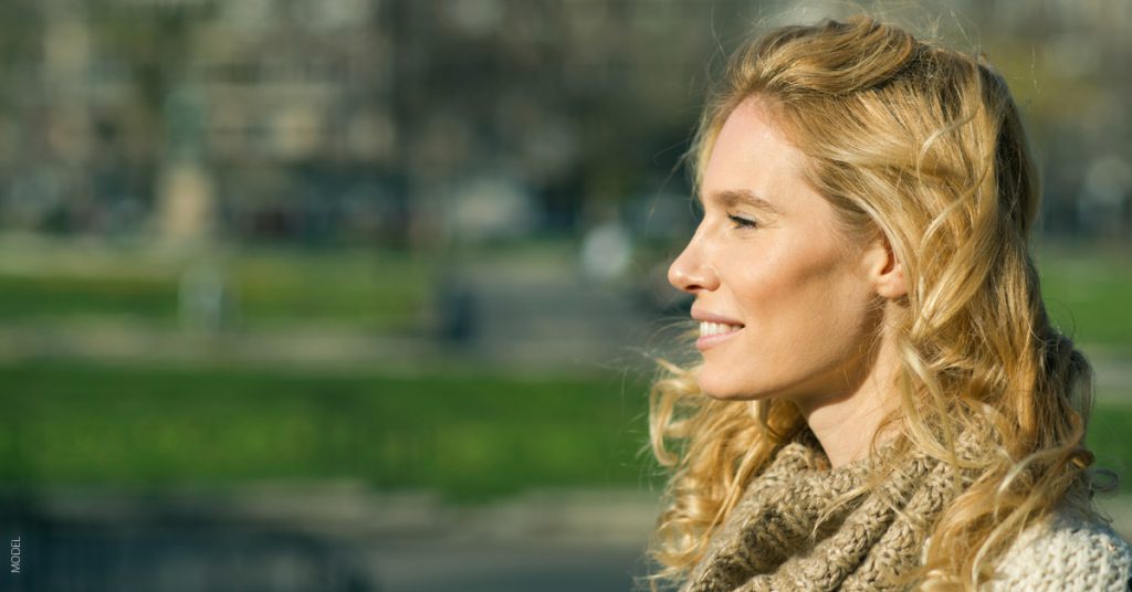 Blonde woman's profile with a beautiful defined jawline.